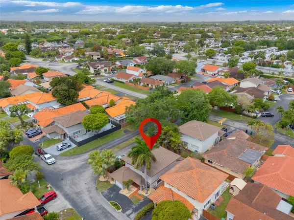 an aerial view of residential houses with outdoor space