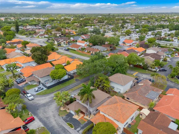 an aerial view of residential houses with outdoor space