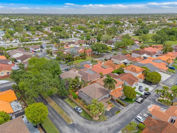 an aerial view of residential houses with outdoor space