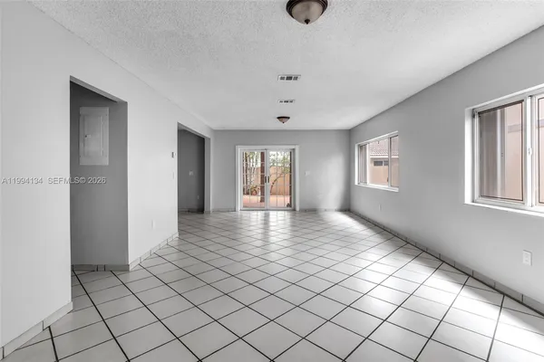 a view of an empty room and window
