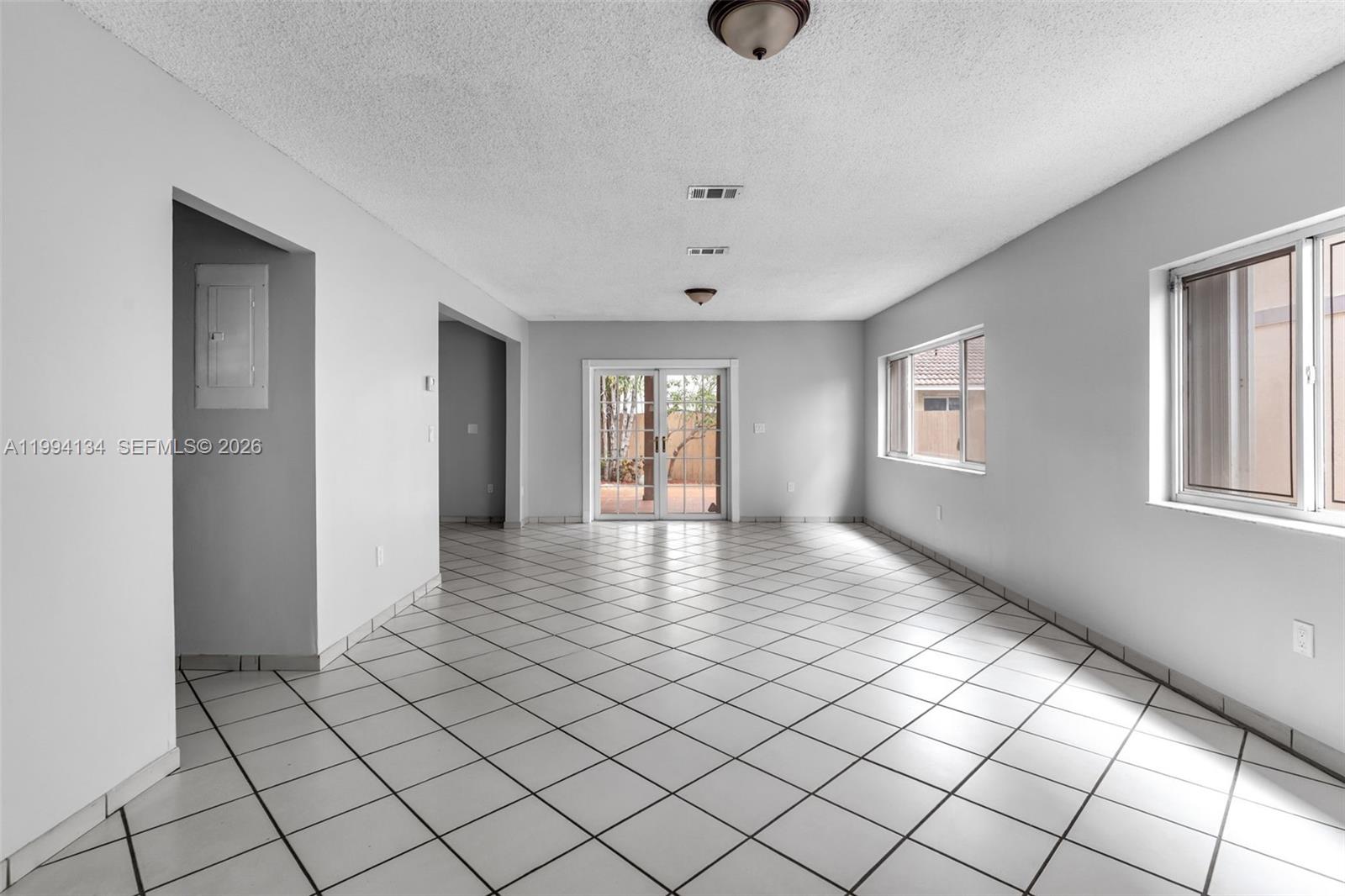 11319 Southwest 73rd Lane Miami, FL 33173 - Photo 4 of 43 a view of an empty room and window