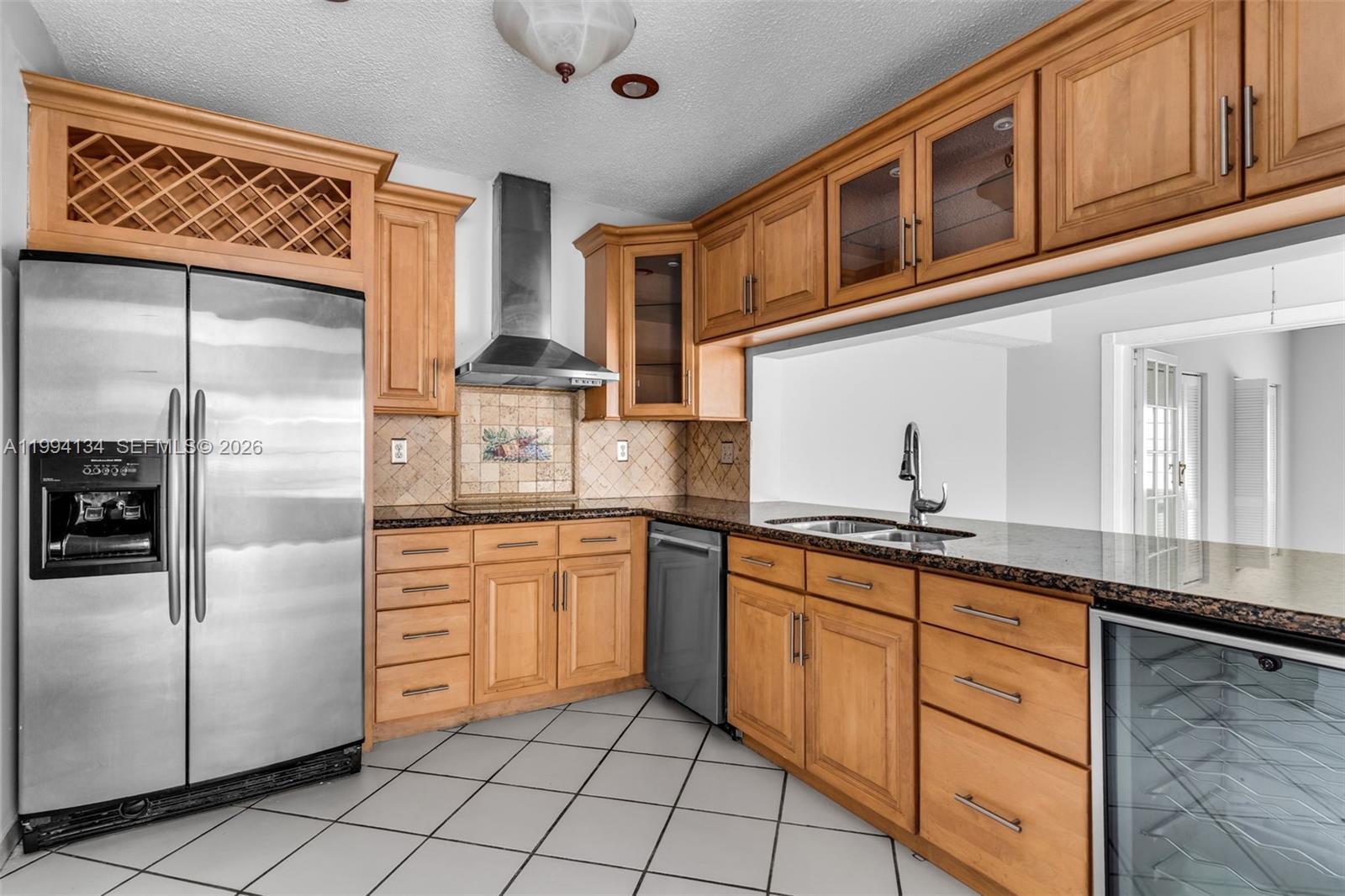 11319 Southwest 73rd Lane Miami, FL 33173 - Photo 7 of 43 a kitchen with stainless steel appliances granite countertop a refrigerator and a stove