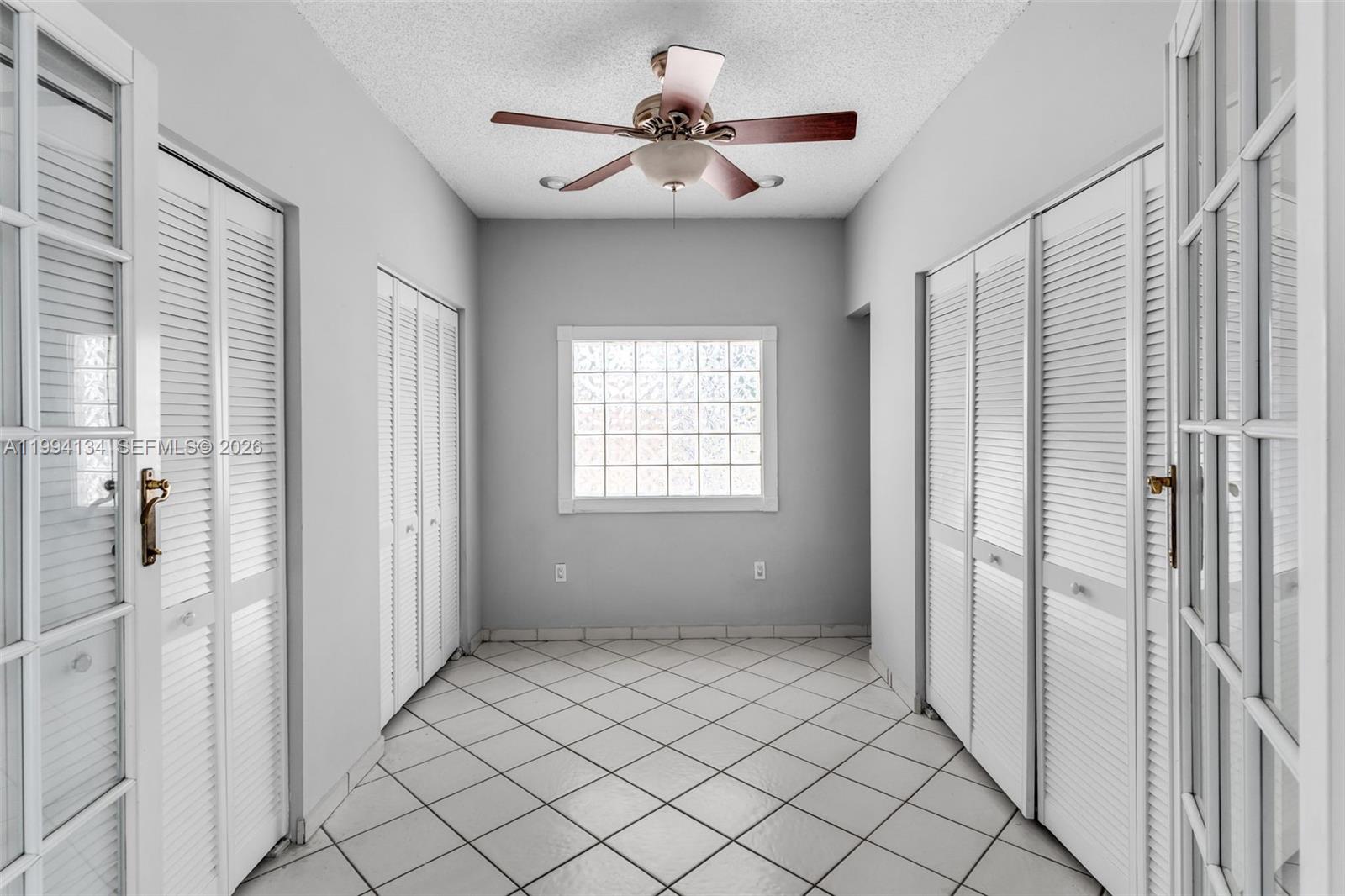 11319 Southwest 73rd Lane Miami, FL 33173 - Photo 10 of 43 a view of an empty room with a window