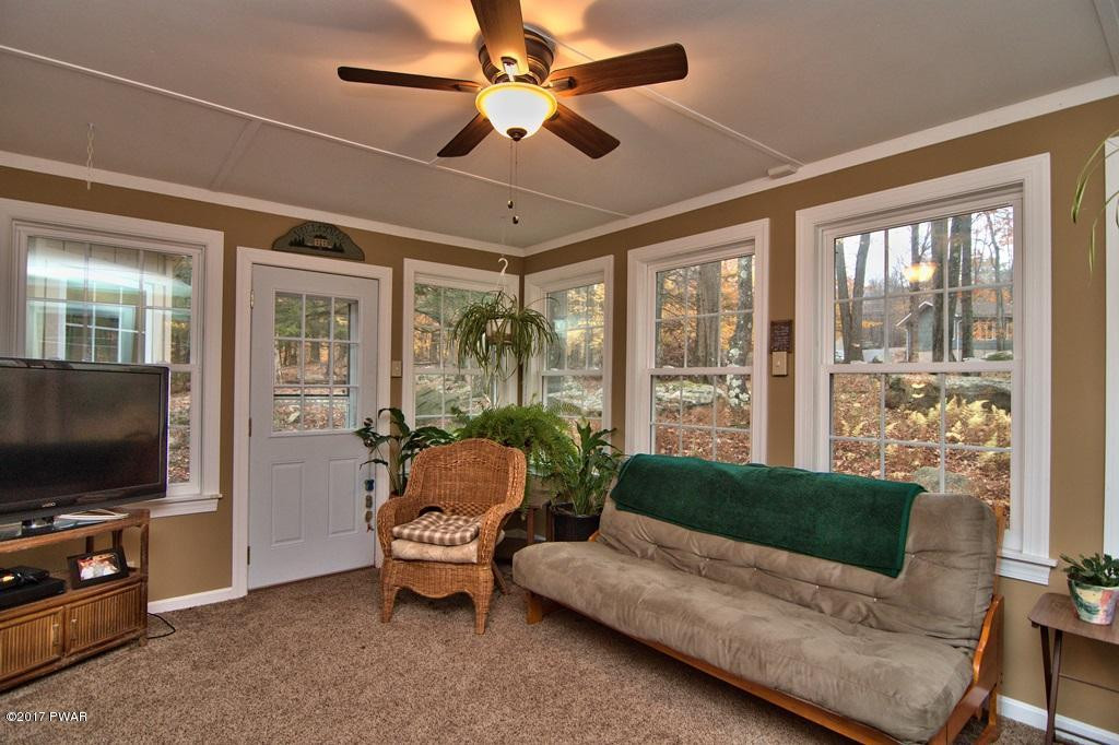 3296 Northgate Road Lake Ariel, PA 18436 - Photo 28 of 33 a living room with furniture and a flat screen tv