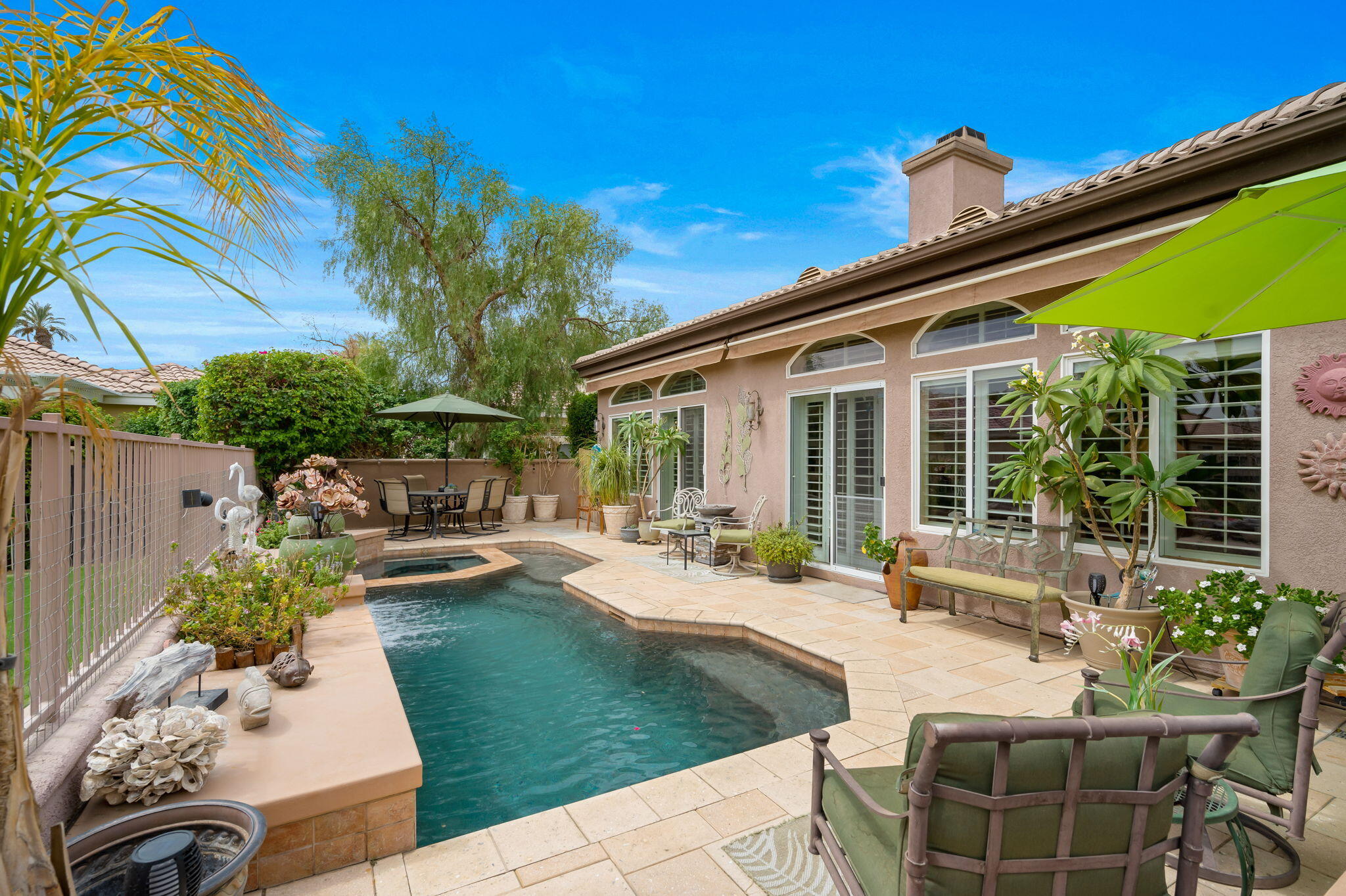 48908 Heifitz Drive Indio, CA 92201 - Photo 13 of 42 a view of a house with backyard sitting area and swimming pool