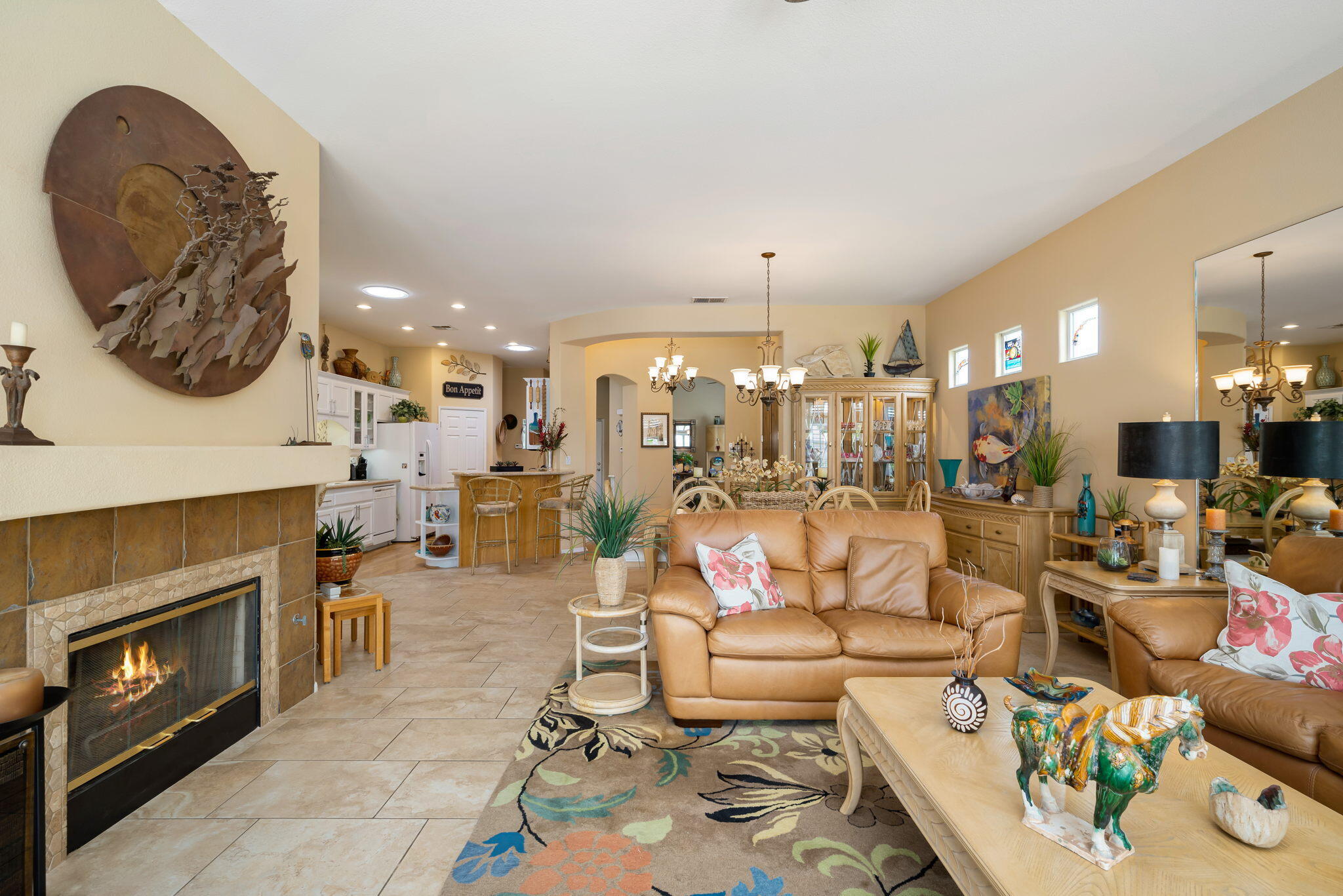 48908 Heifitz Drive Indio, CA 92201 - Photo 16 of 42 a living room with furniture and a fireplace