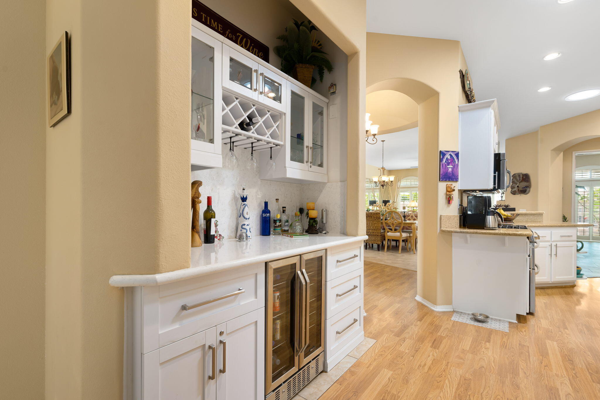48908 Heifitz Drive Indio, CA 92201 - Photo 26 of 42 a kitchen with cabinets and wooden floor