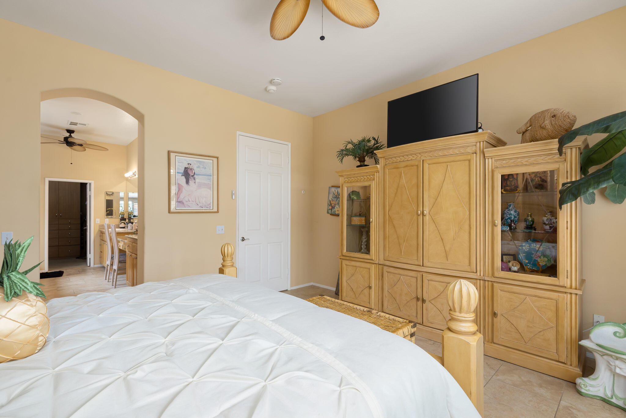48908 Heifitz Drive Indio, CA 92201 - Photo 30 of 42 a bedroom with a bed and a flat screen tv