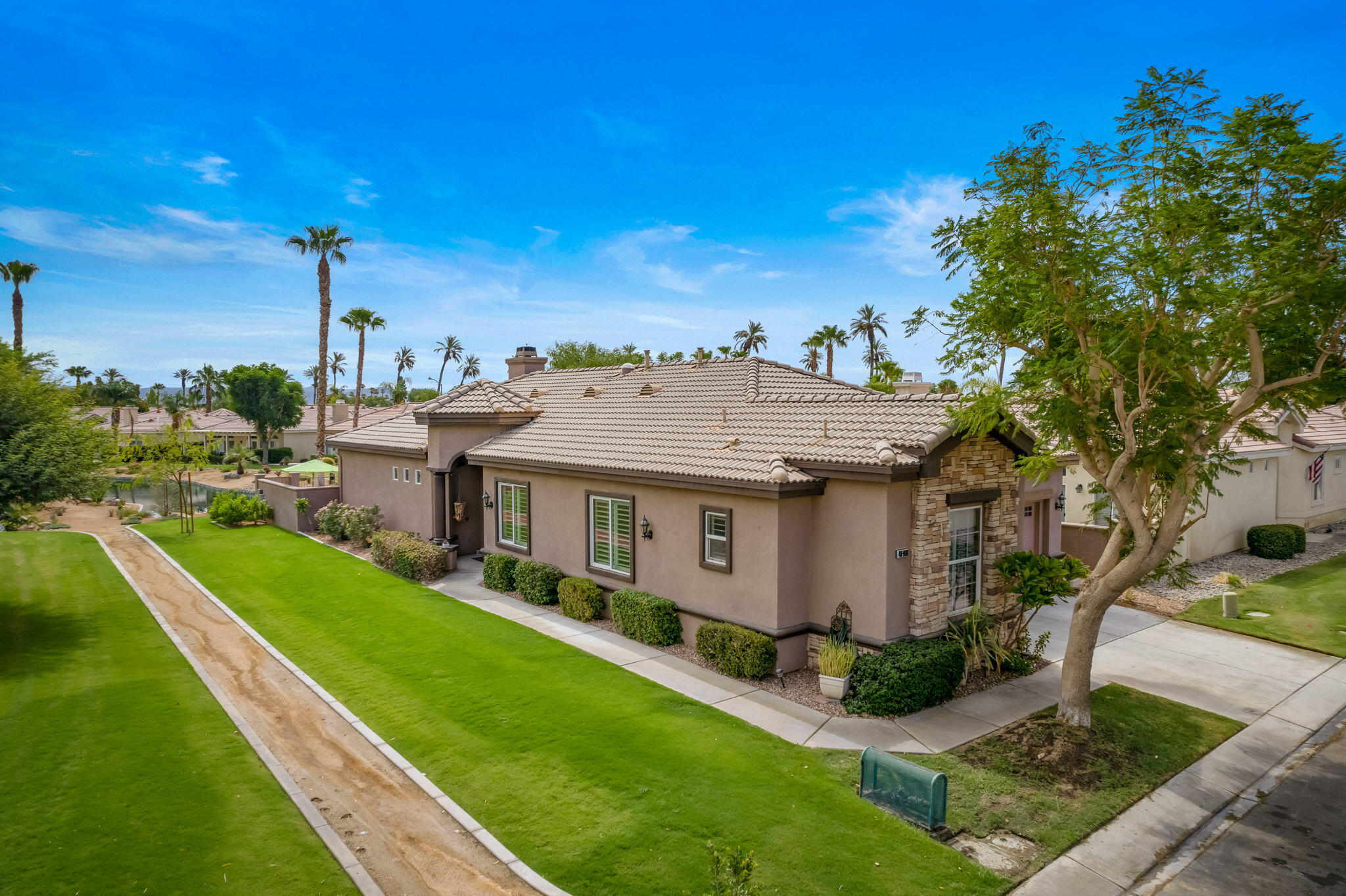 48908 Heifitz Drive Indio, CA 92201 - Photo 3 of 42 a aerial view of a house with a yard table and chairs