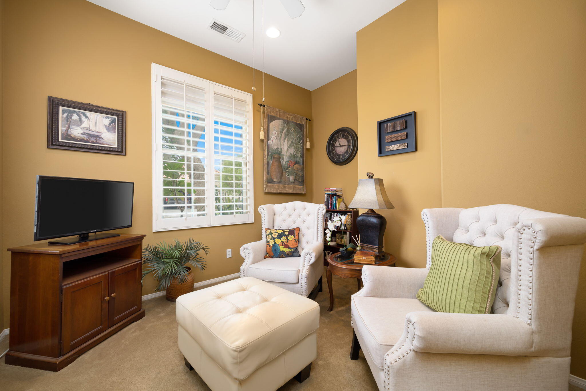 48908 Heifitz Drive Indio, CA 92201 - Photo 34 of 42 a living room with furniture and a flat screen tv
