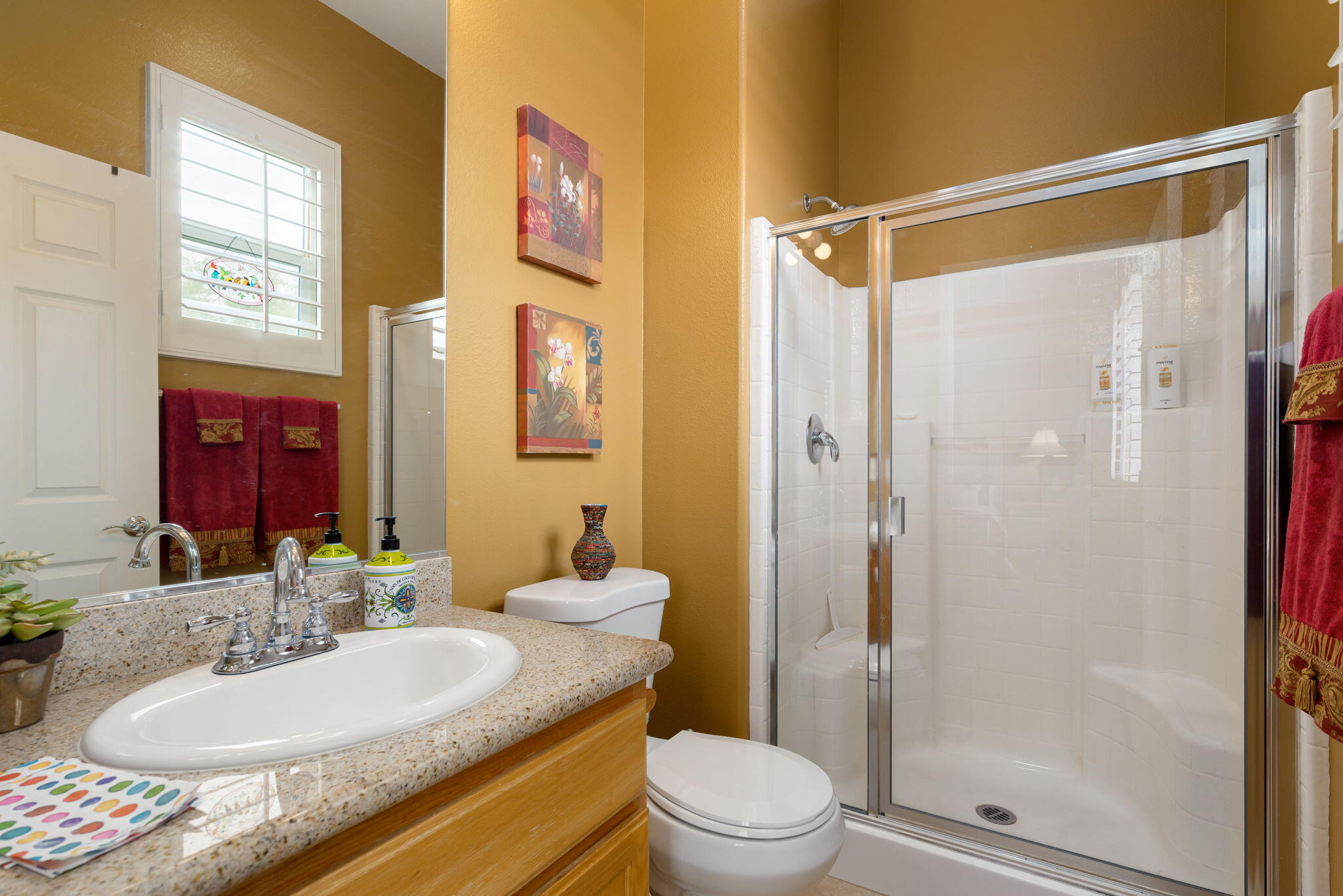 48908 Heifitz Drive Indio, CA 92201 - Photo 35 of 42 a bathroom with a granite countertop sink toilet and shower
