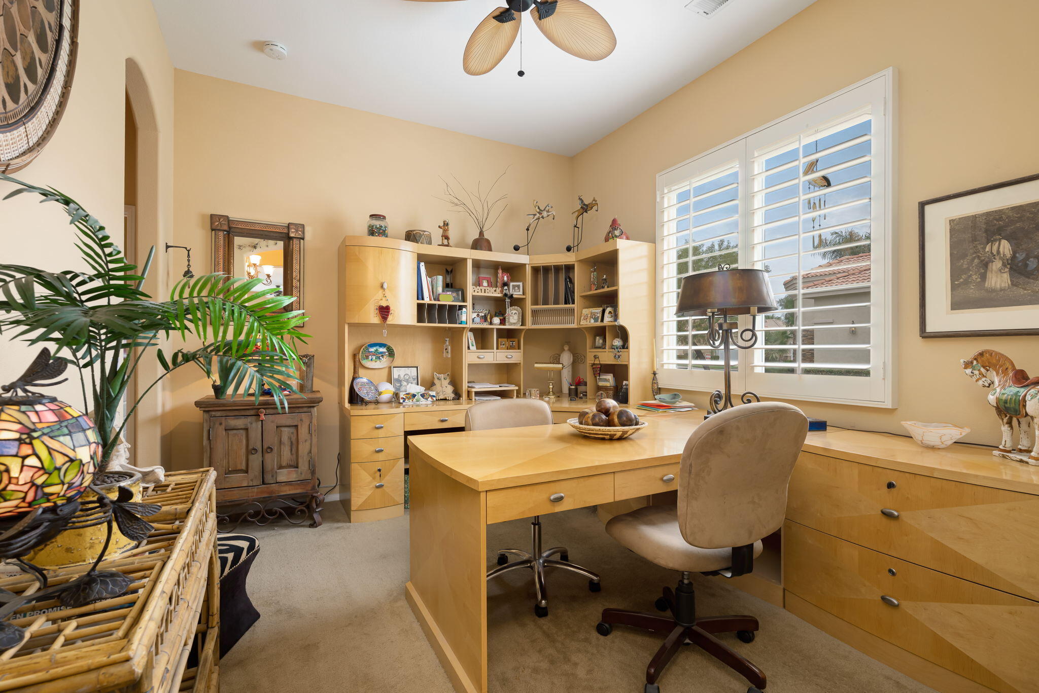 48908 Heifitz Drive Indio, CA 92201 - Photo 36 of 42 a view of a workspace with furniture and a window