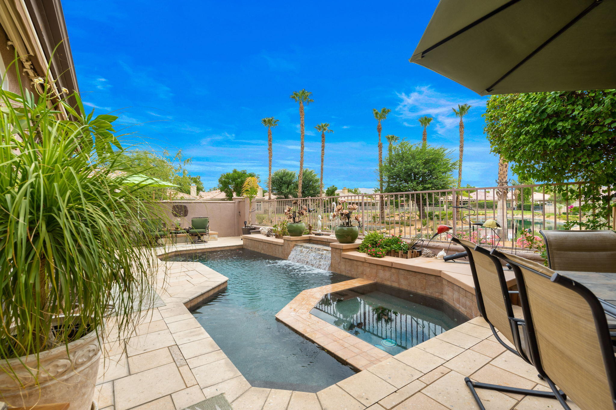 48908 Heifitz Drive Indio, CA 92201 - Photo 9 of 42 a view of a patio with swimming pool