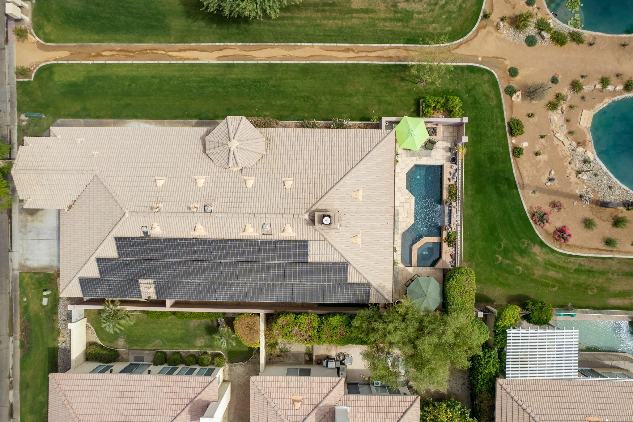 48908 Heifitz Drive Indio, CA 92201 - Photo 10 of 42 an aerial view of a house with outdoor space and tennis court