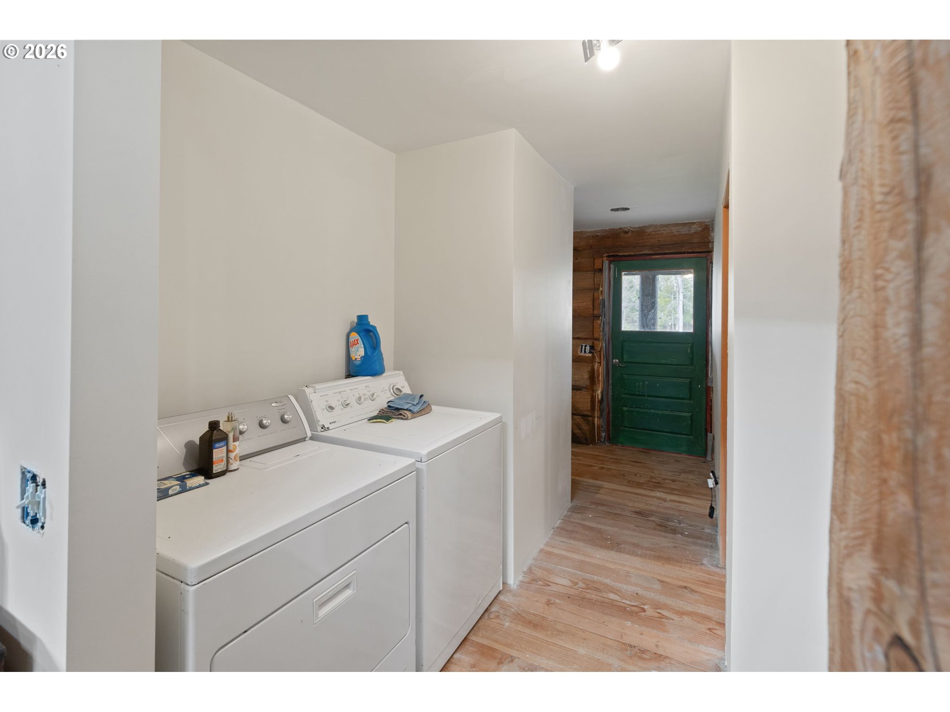 4420 Holland Loop Road Cave Junction, OR 97523 - Photo 14 of 46 a utility room with dryer and washer