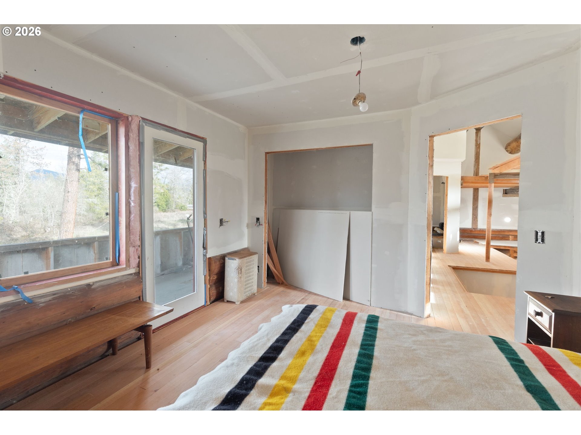 4420 Holland Loop Road Cave Junction, OR 97523 - Photo 24 of 46 a room with furniture and a window