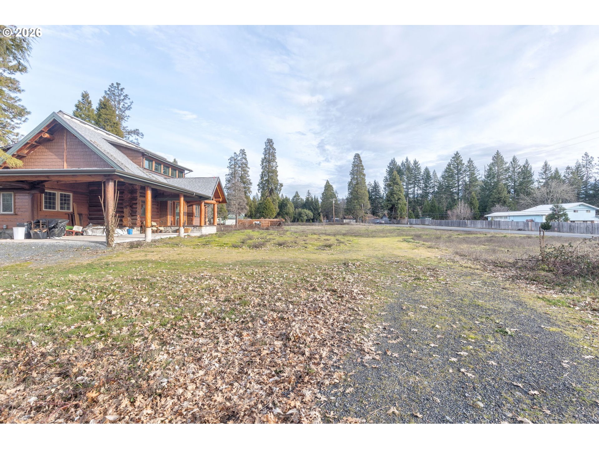4420 Holland Loop Road Cave Junction, OR 97523 - Photo 30 of 46 a view of an house with outdoor space and trees