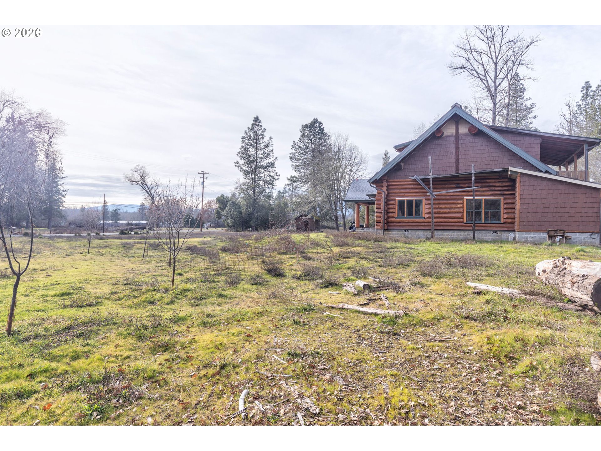 4420 Holland Loop Road Cave Junction, OR 97523 - Photo 31 of 46 a view of a house with a yard