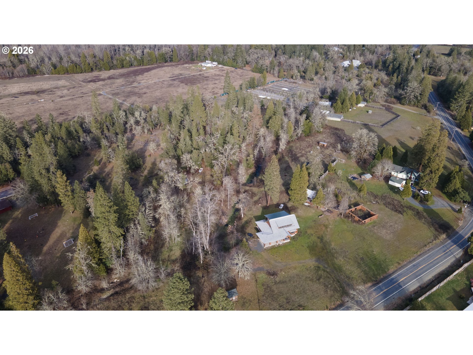 4420 Holland Loop Road Cave Junction, OR 97523 - Photo 45 of 46 a open area with lots of trees