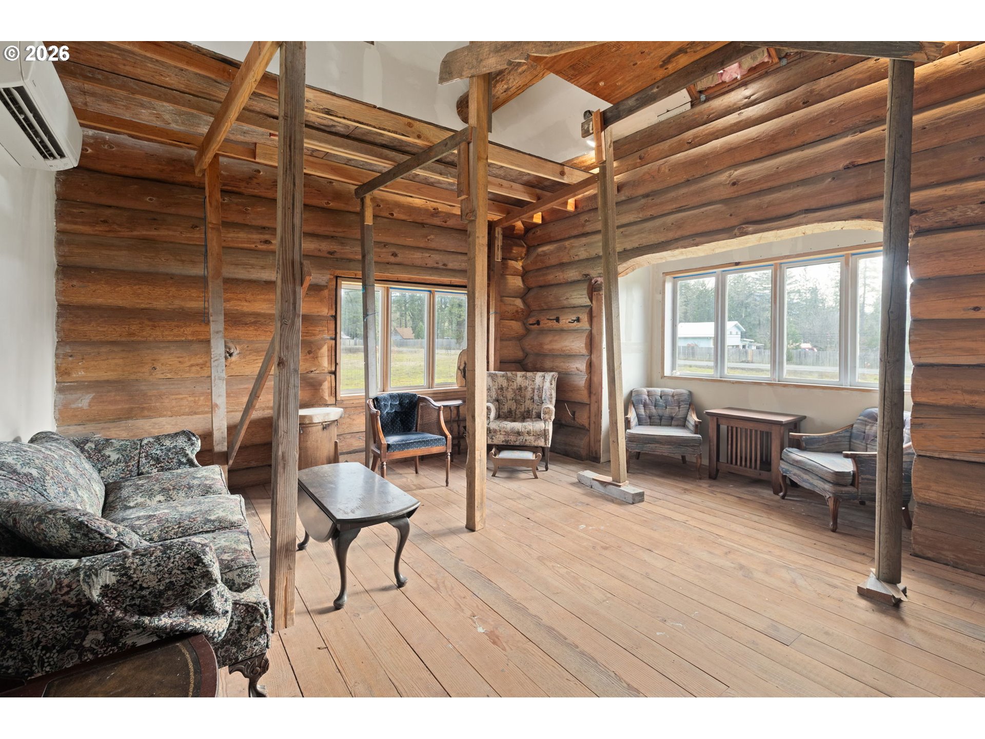 4420 Holland Loop Road Cave Junction, OR 97523 - Photo 10 of 46 a living room with furniture and a wooden floor