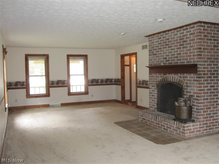2648 Johnnycake Road Mogadore, OH 44260 - Photo 10 of 25 Living room looking towards front of home. Carpet is new