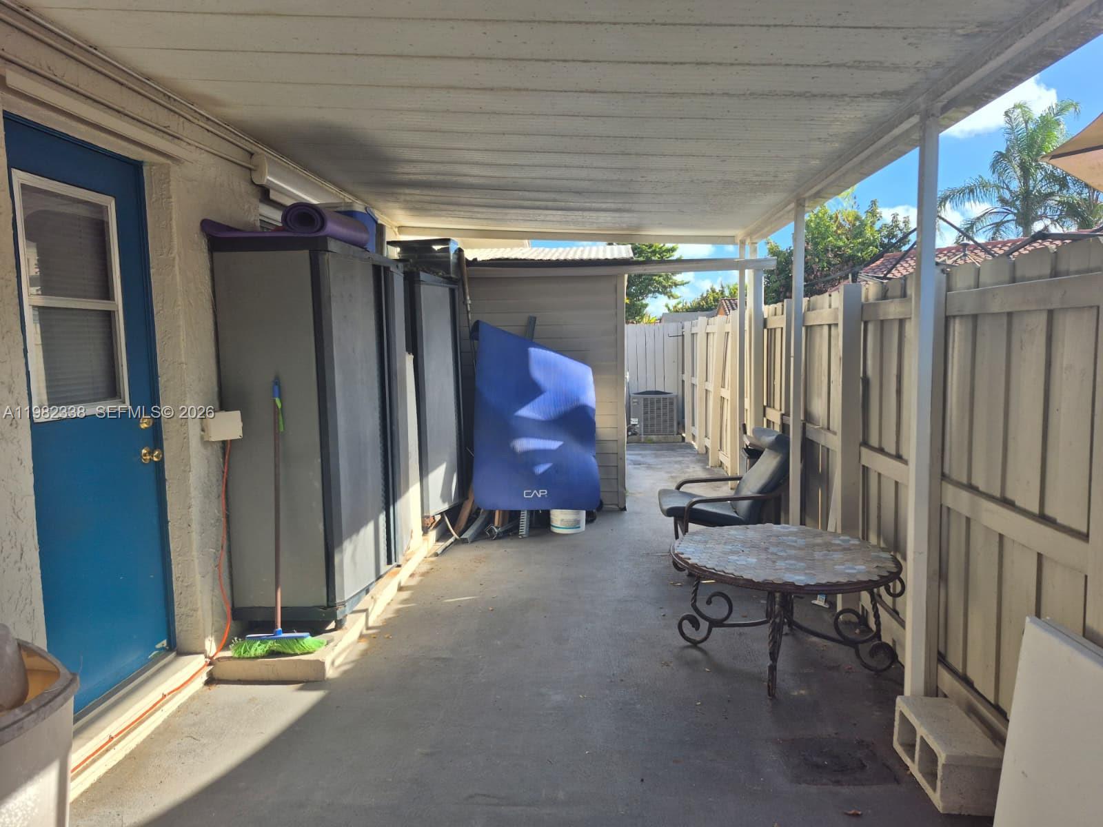 14530 Southwest 110th Street Miami, FL 33186 - Photo 35 of 45 a view of outdoor space with porch and furniture