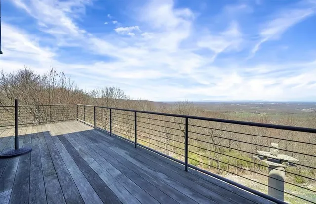a view of outdoor space with wooden floor