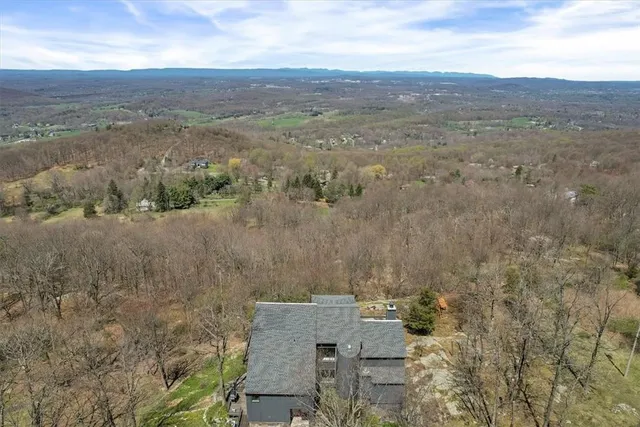an aerial view of residential house and outdoor space