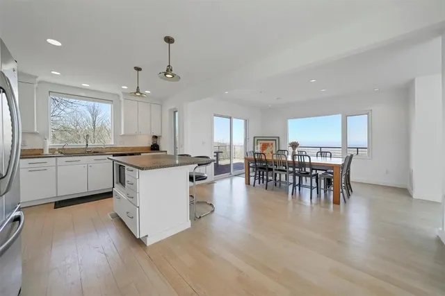 a kitchen with lots of counter top space and living room
