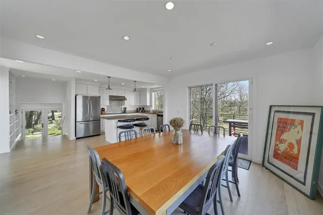 a dining room with furniture and wooden floor