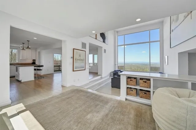a open kitchen with cabinets and wooden floor