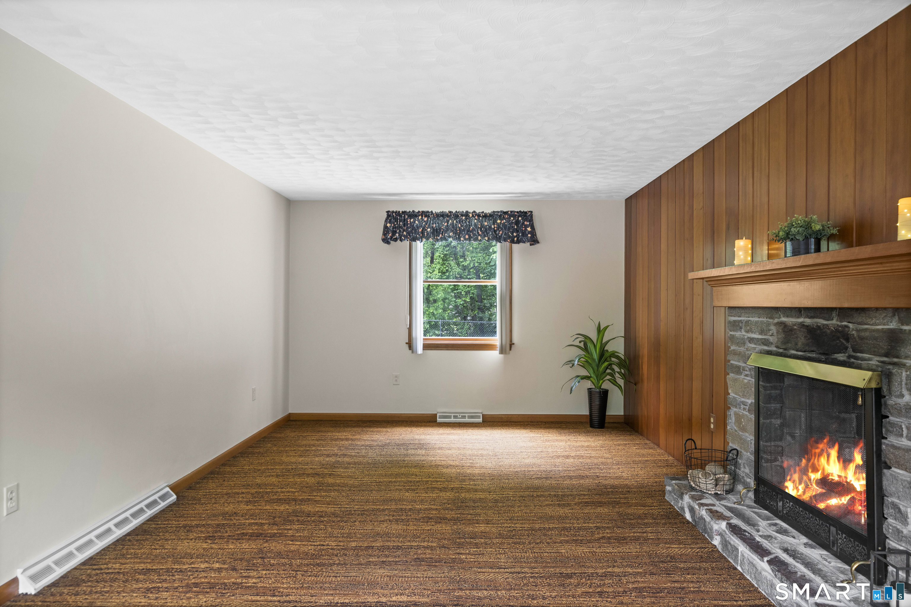 6 Cartier Road Enfield, CT 06082 - Photo 19 of 40 a view of an empty room with window and fire place
