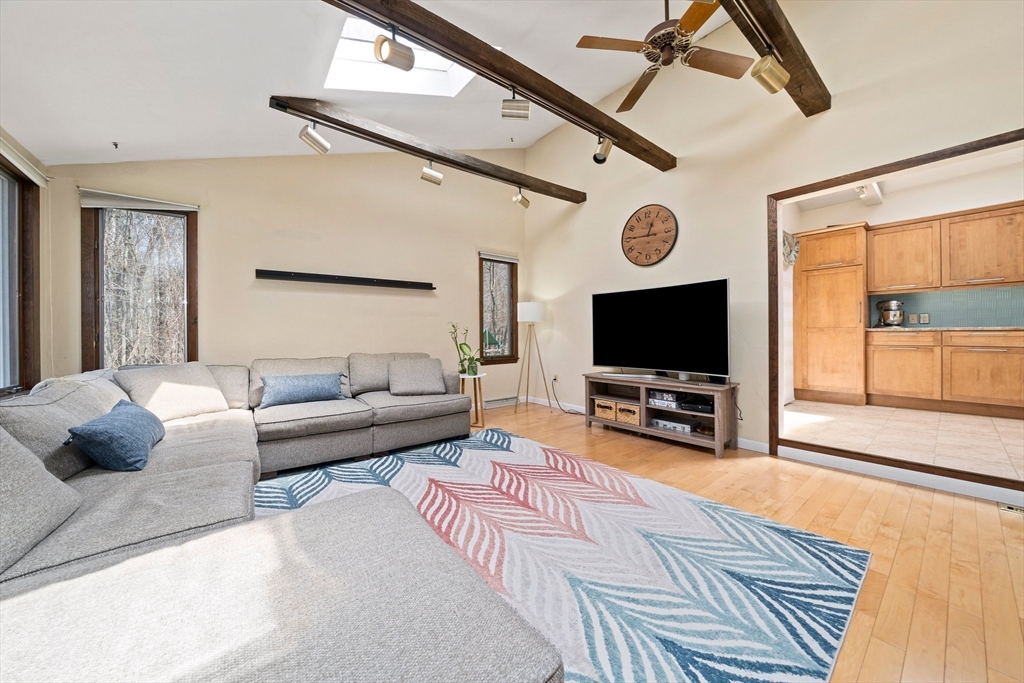 20 Condor Road Sharon, MA 02067 - Photo 15 of 41 a living room with furniture and a flat screen tv