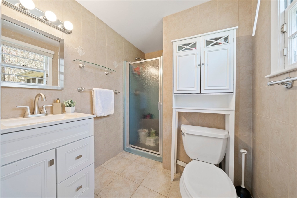 20 Condor Road Sharon, MA 02067 - Photo 19 of 41 a bathroom with a toilet sink and mirror