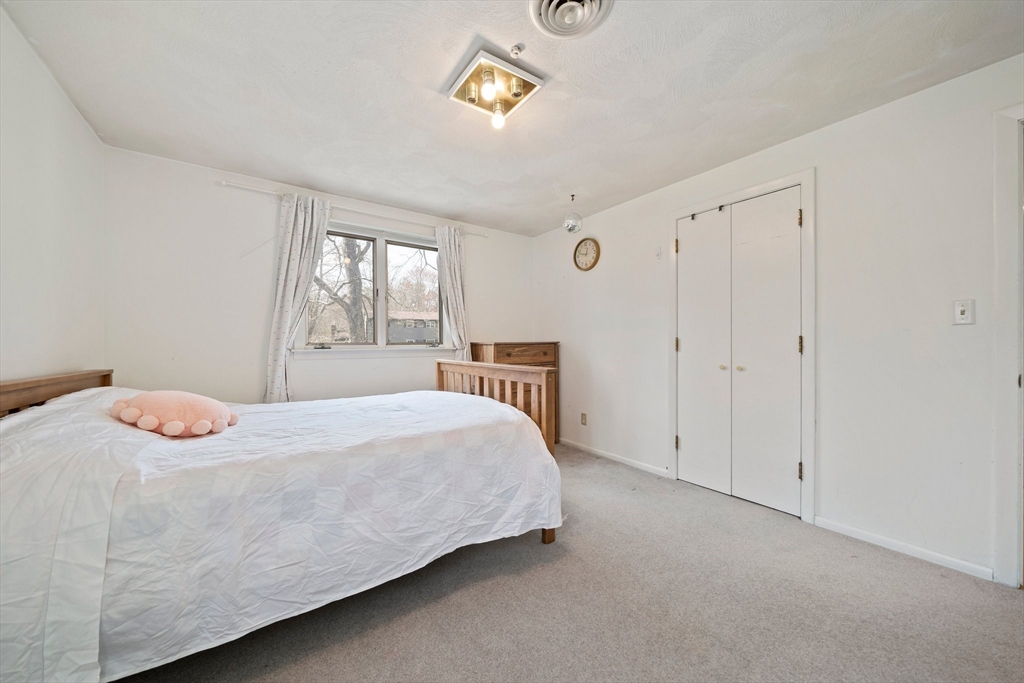 20 Condor Road Sharon, MA 02067 - Photo 21 of 41 a bedroom with a bed and a window