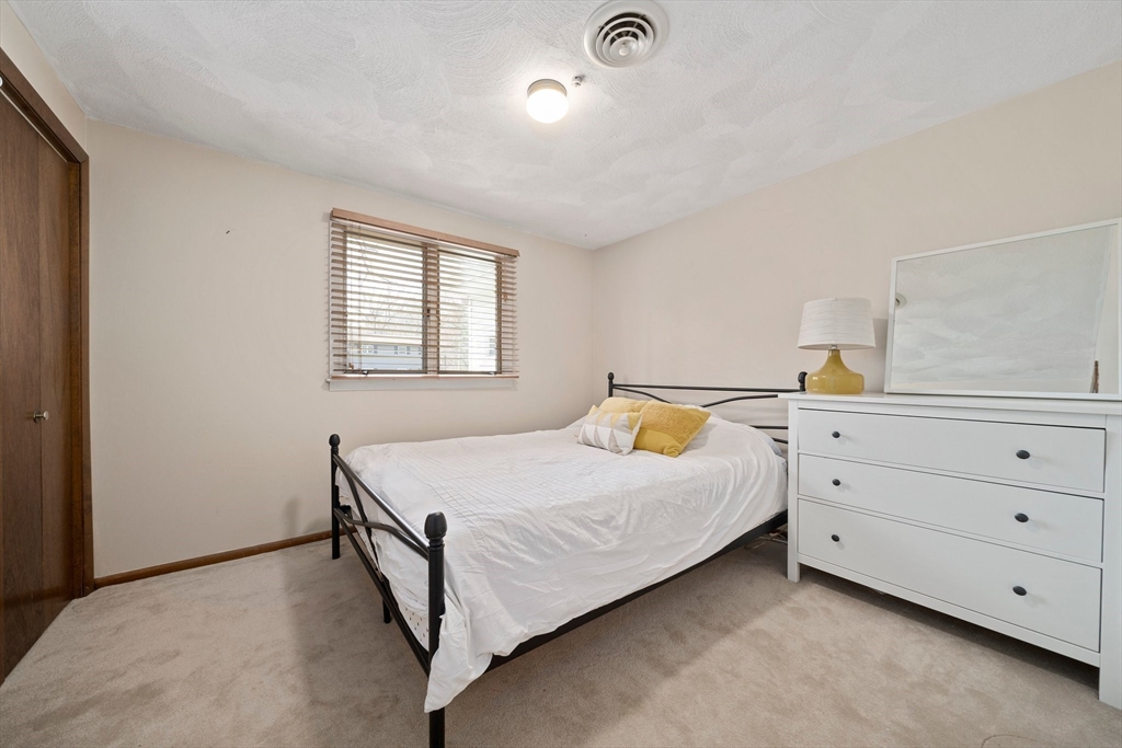 20 Condor Road Sharon, MA 02067 - Photo 22 of 41 a bedroom with a bed and a window