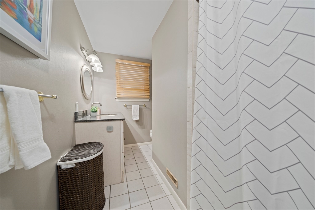 20 Condor Road Sharon, MA 02067 - Photo 23 of 41 a bathroom with a sink and mirror