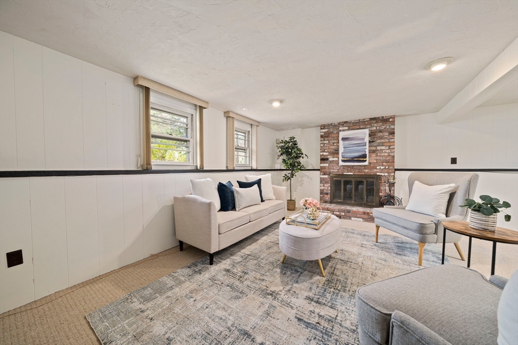 20 Condor Road Sharon, MA 02067 - Photo 26 of 41 a living room with furniture and a potted plant