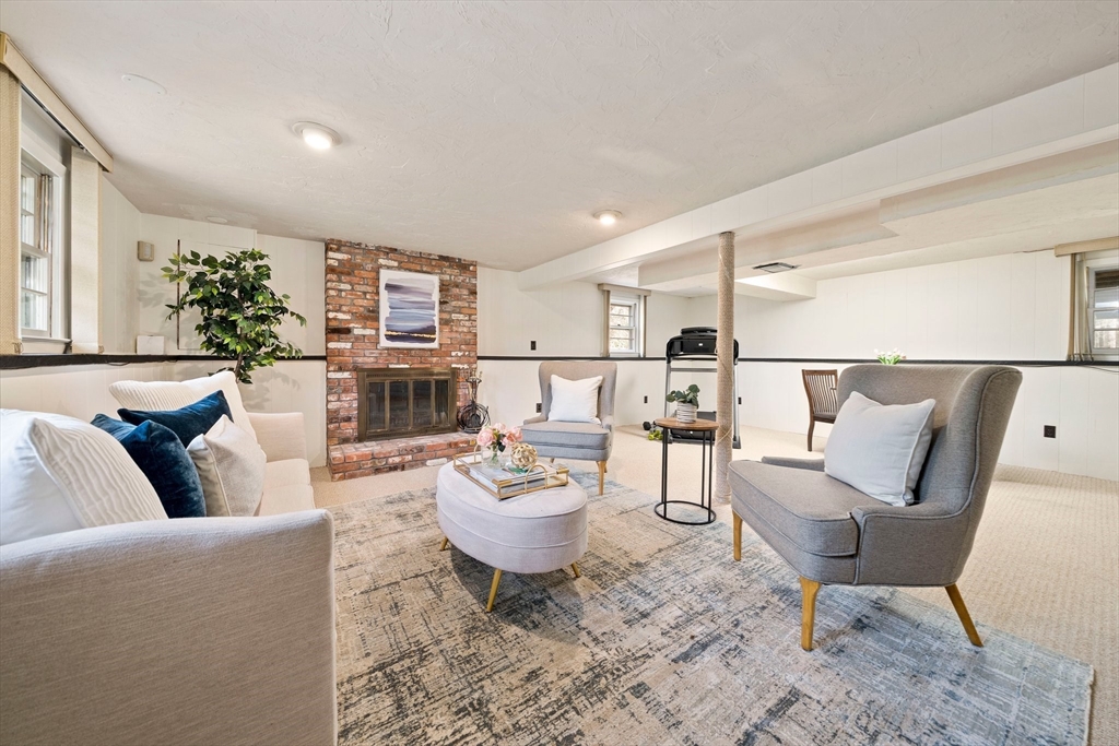 20 Condor Road Sharon, MA 02067 - Photo 6 of 41 a living room with furniture and a fireplace