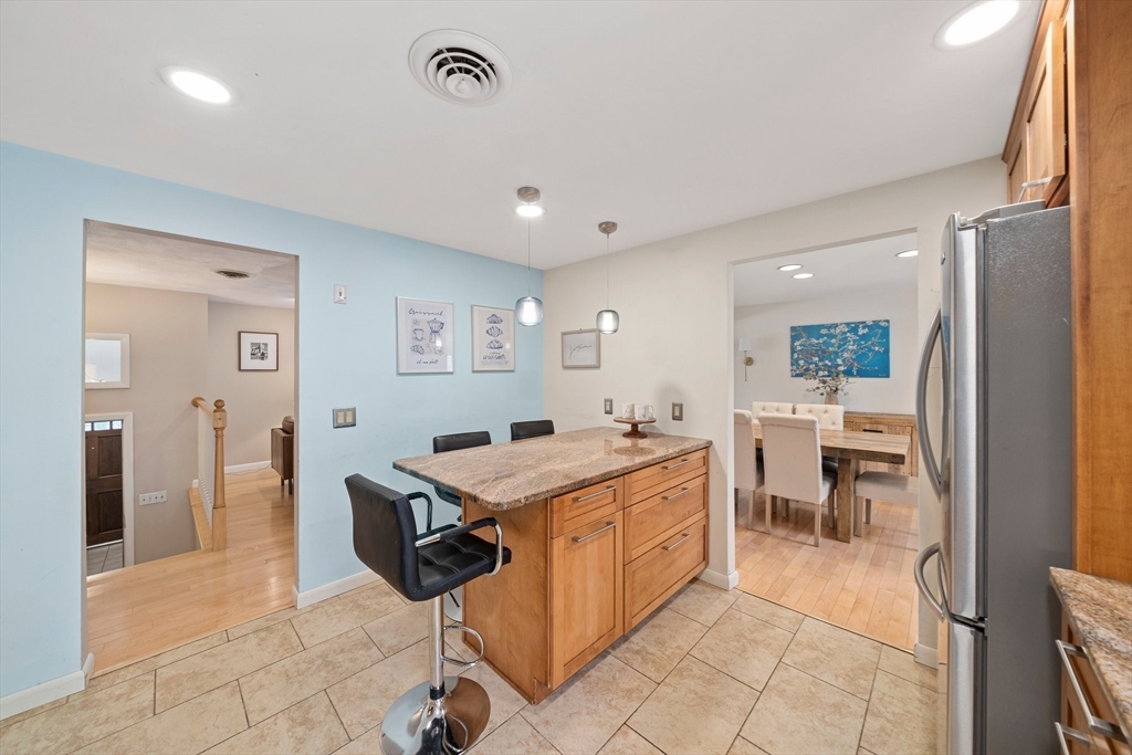 20 Condor Road Sharon, MA 02067 - Photo 7 of 41 a kitchen with a sink and chairs