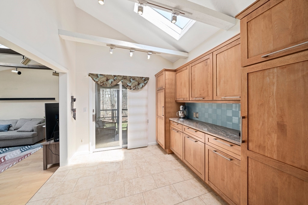 20 Condor Road Sharon, MA 02067 - Photo 9 of 41 a kitchen with white cabinets and appliances
