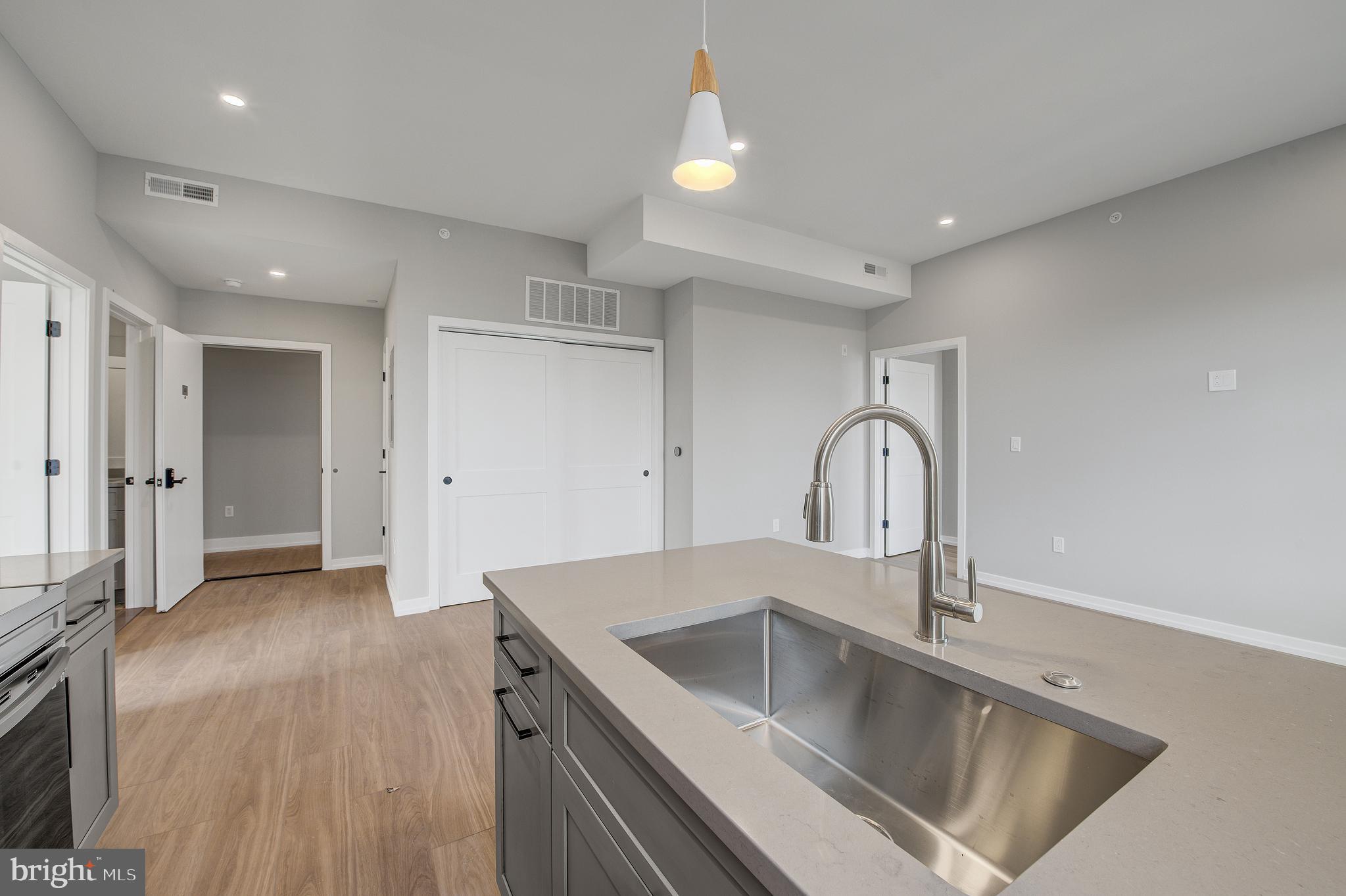 2445 Innovator Way, Unit 4I Philadelphia, PA 19146 - Photo 6 of 12 a view of a kitchen with a sink and refrigerator