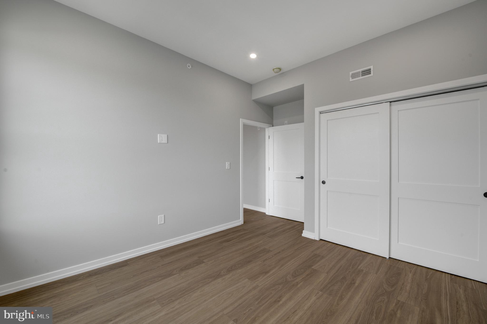 2445 Innovator Way, Unit 4I Philadelphia, PA 19146 - Photo 10 of 12 a view of an empty room with wooden floor