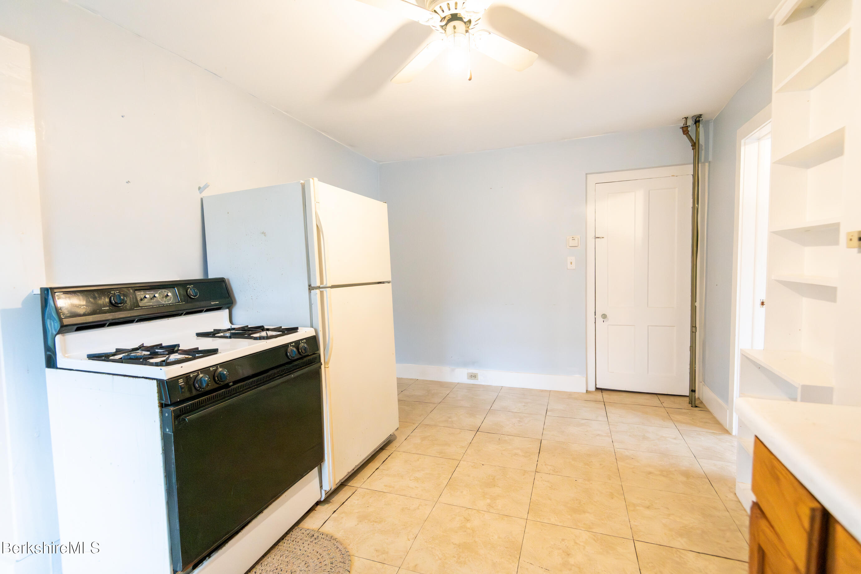 44 Main Street West Stockbridge, MA 01266 - Photo 20 of 28 a kitchen with a stove and a refrigerator