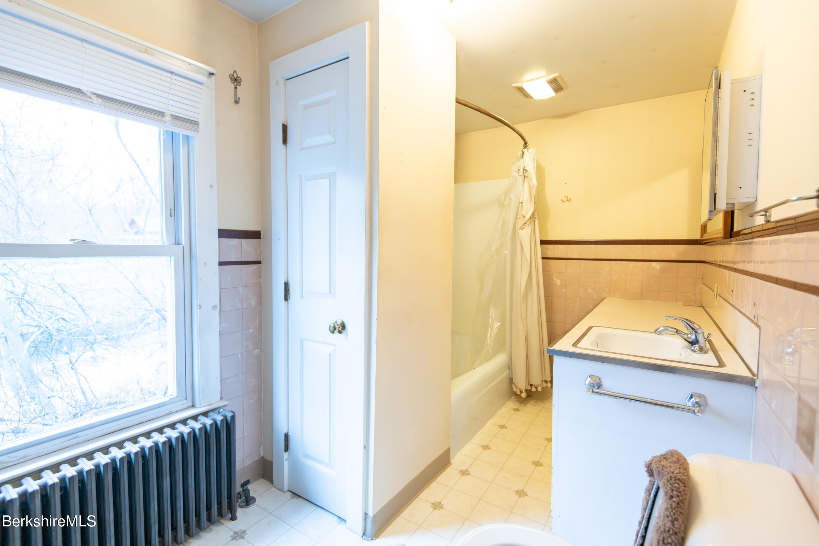 44 Main Street West Stockbridge, MA 01266 - Photo 21 of 28 a bathroom with a window a sink and a mirror