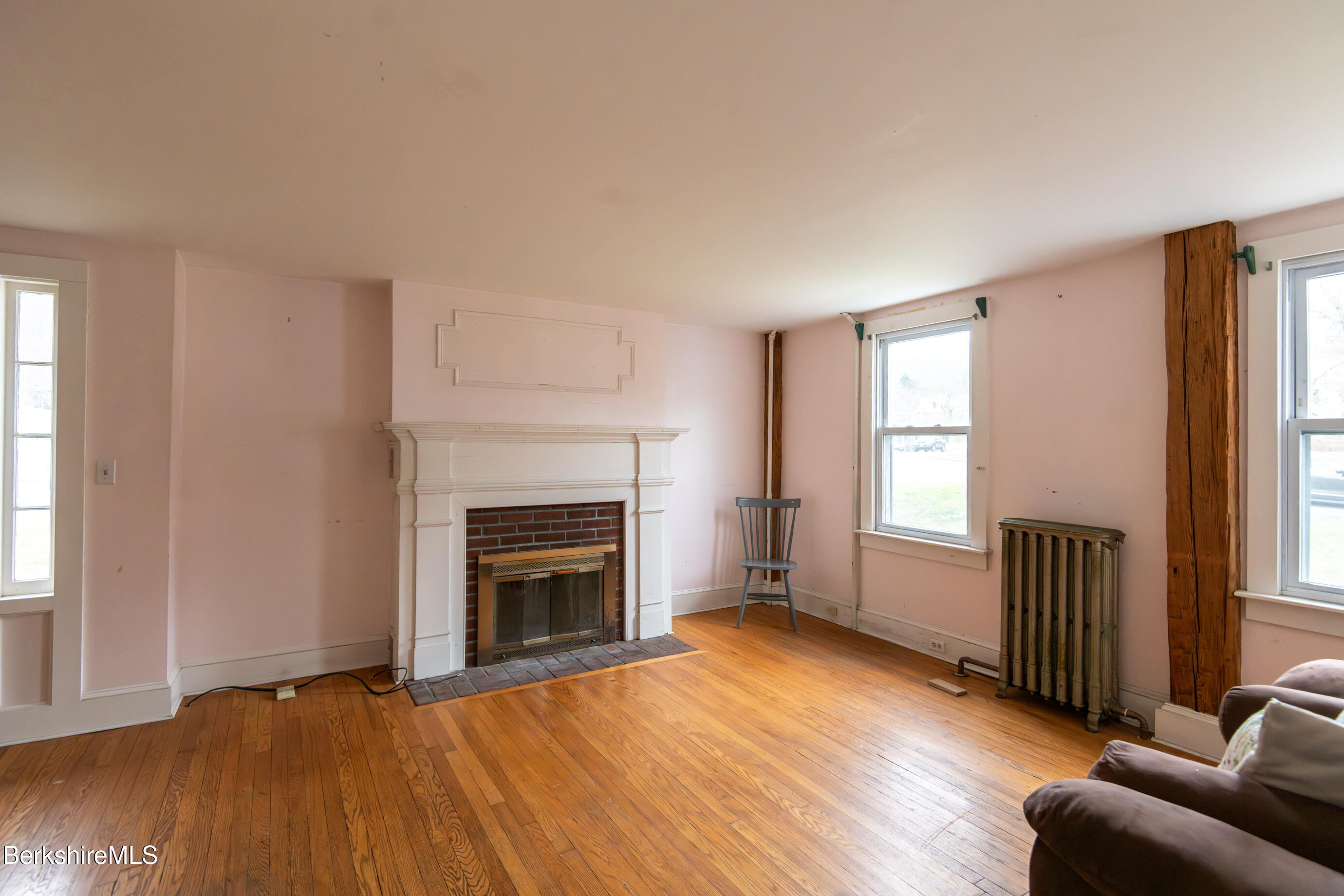 44 Main Street West Stockbridge, MA 01266 - Photo 6 of 28 an empty room with windows and fireplace