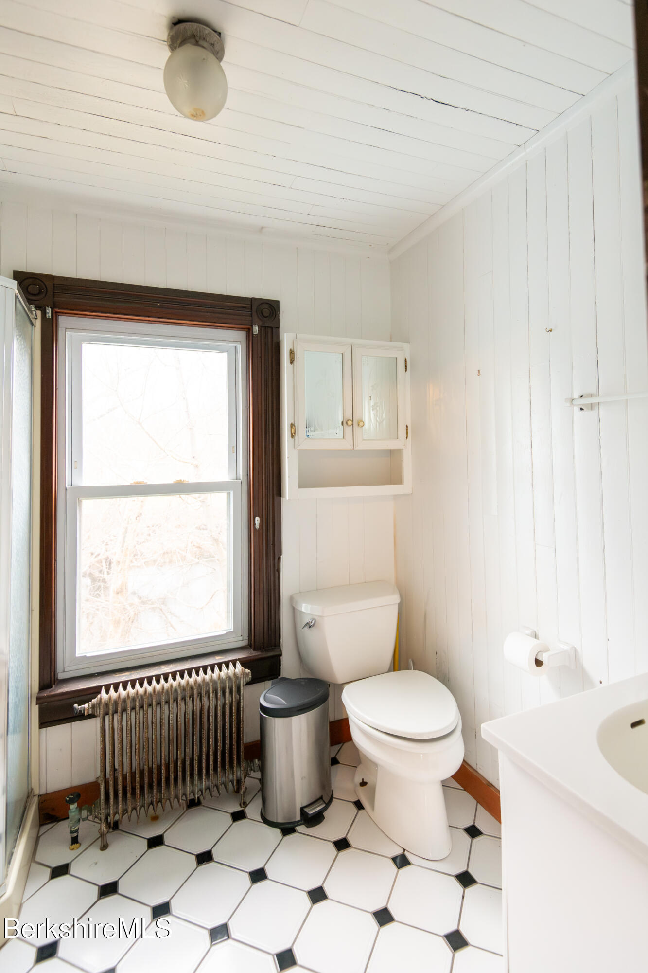 44 Main Street West Stockbridge, MA 01266 - Photo 9 of 28 a bathroom with a toilet a sink and a window