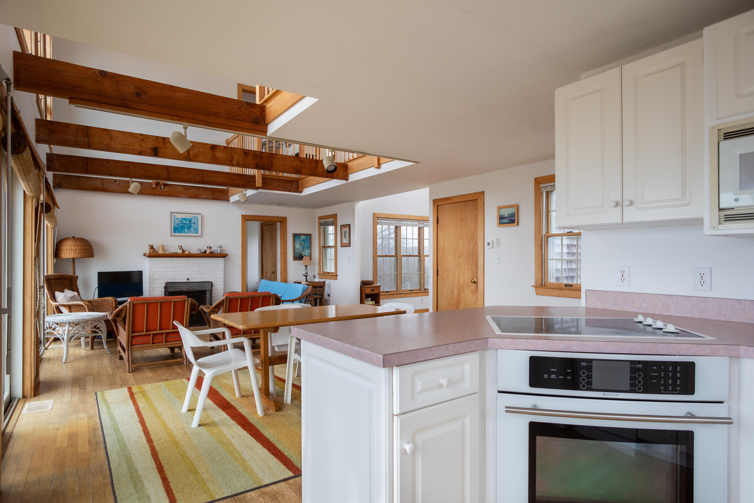 35 Bayberry Lane Eastham, MA 02642 - Photo 12 of 42 a view of a kitchen with a dining table chairs and a stove