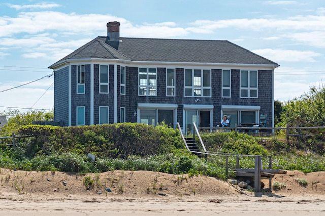 35 Bayberry Lane Eastham, MA 02642 - Photo 2 of 42 a front view of a house with a yard
