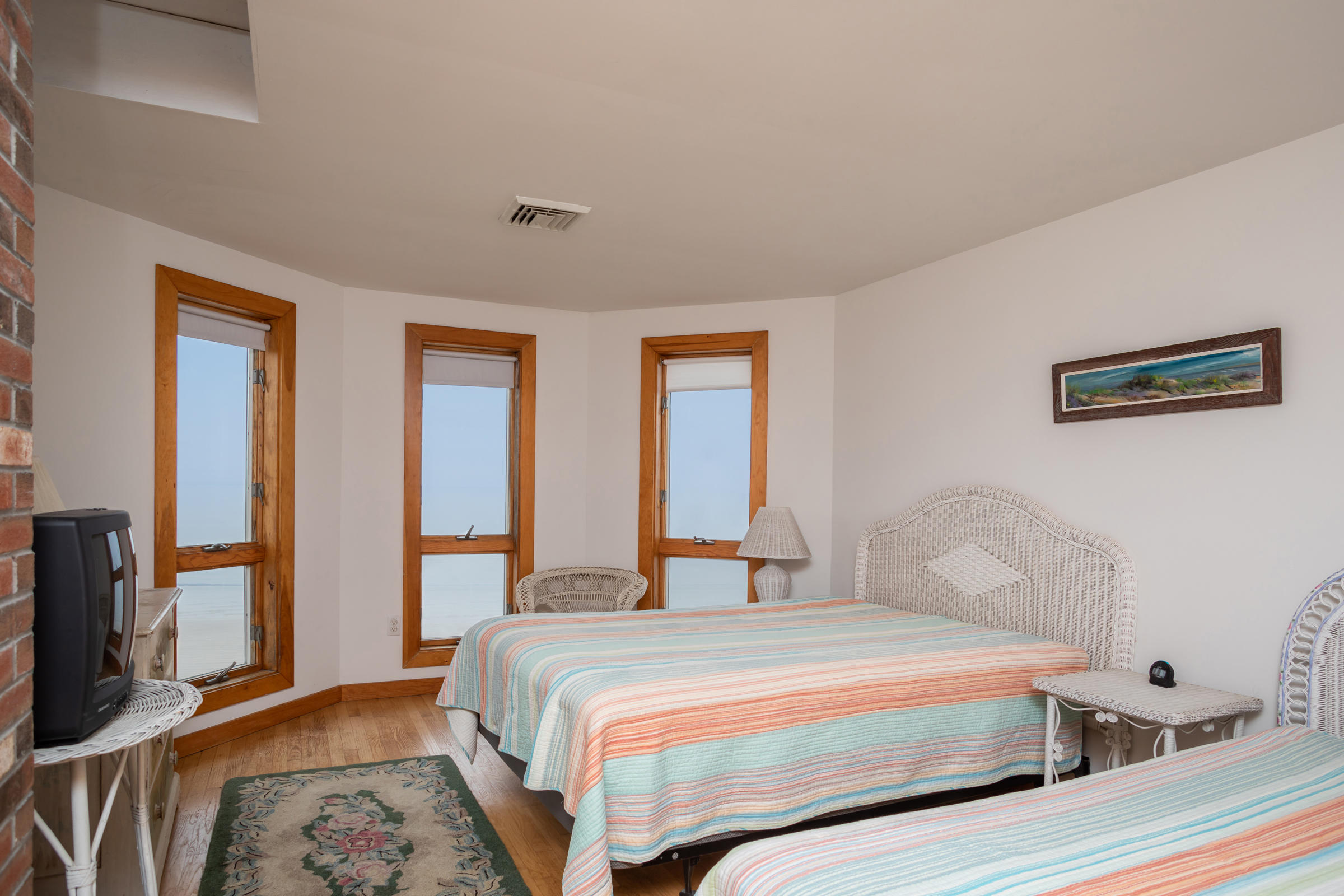 35 Bayberry Lane Eastham, MA 02642 - Photo 29 of 42 a bedroom with a bed and a flat screen tv